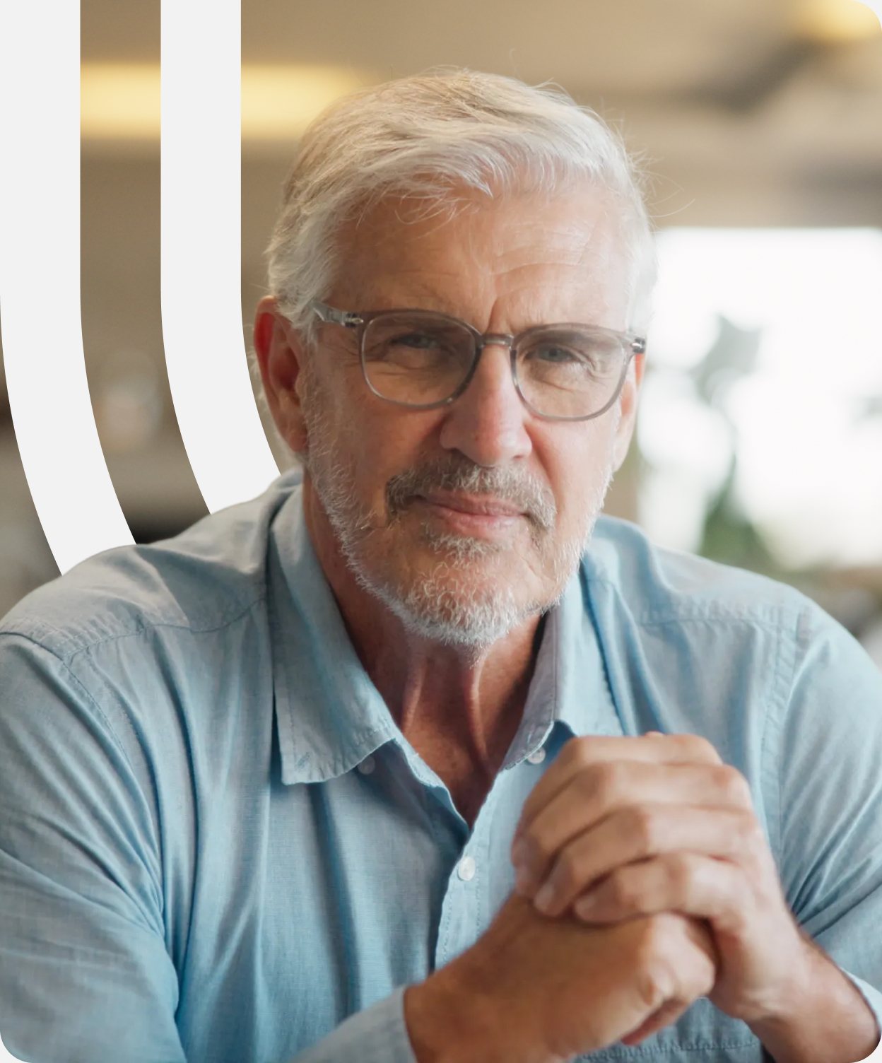 Thoughtful man with folded hands, with sweeping white lines behind him