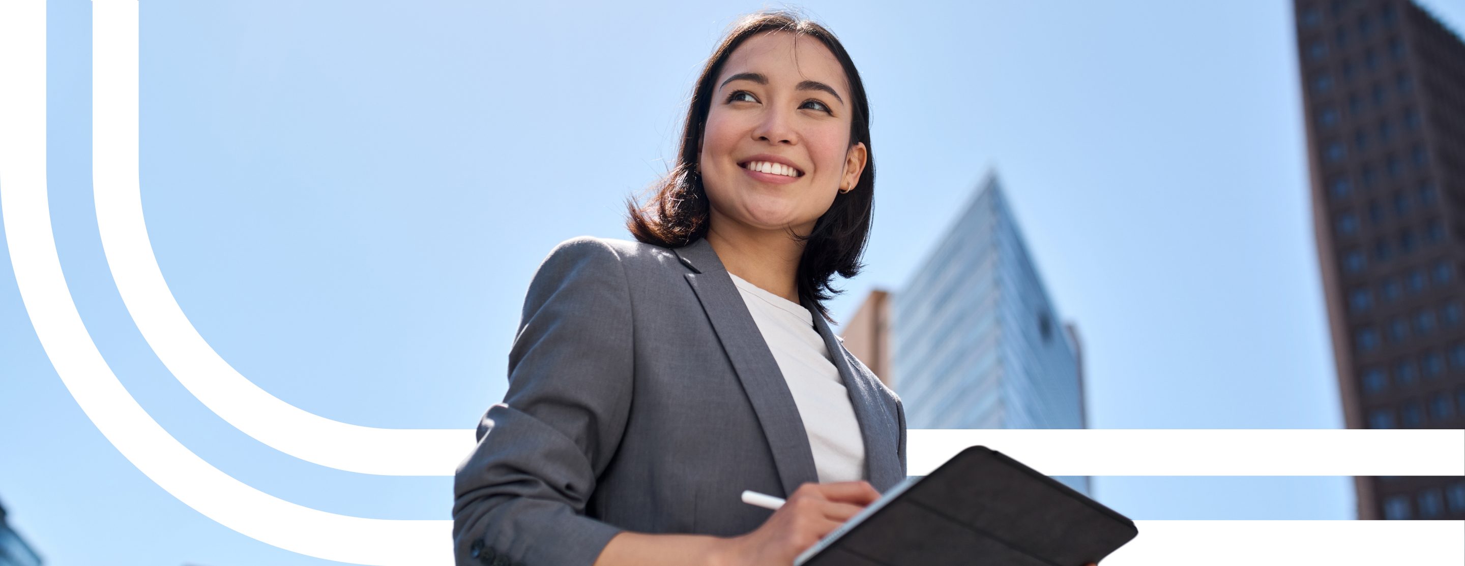 Smiling professional woman holding a tablet, with sweeping white lines across the sky